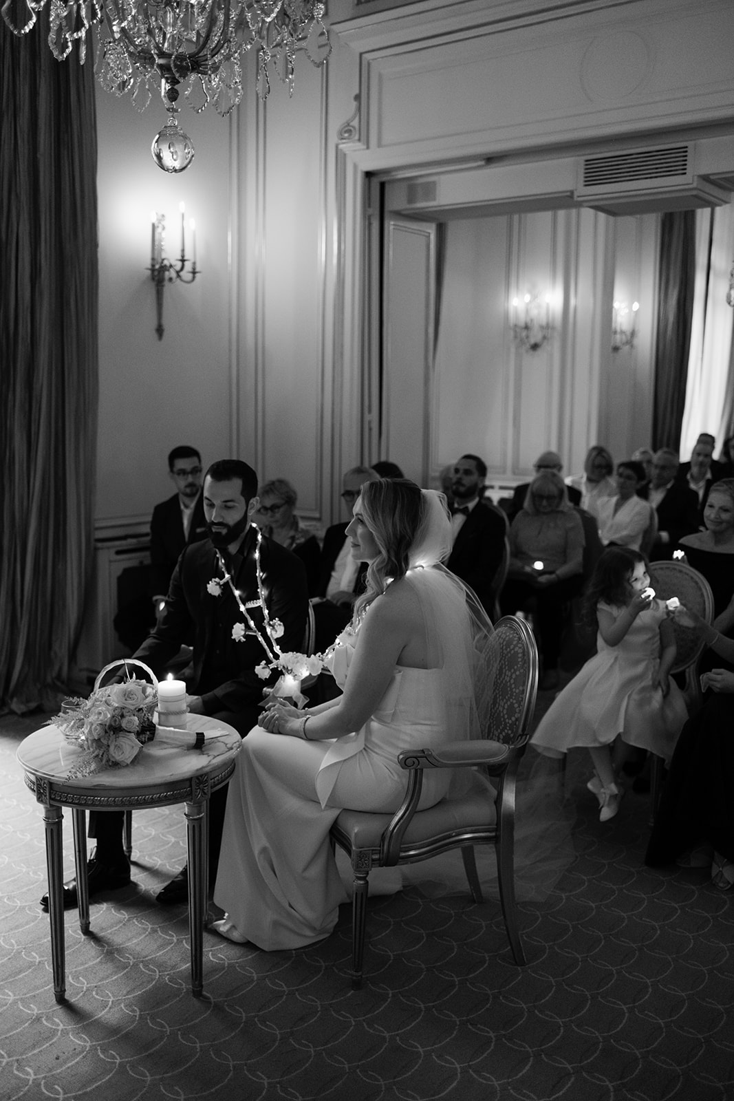 Guests watching an intimate indoor wedding ceremony at Hôtel Plaza Athénée Paris